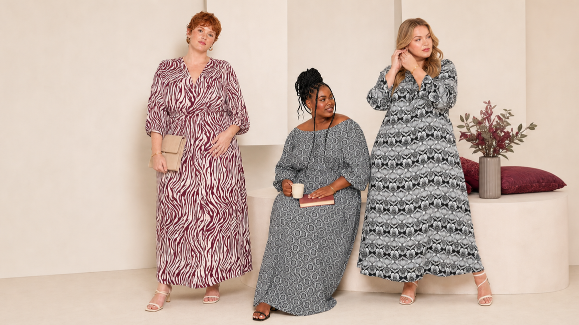 Three plus-size women in burgundy, monochrome and black printed long-sleeve maxi dresses
