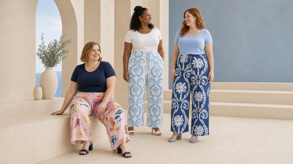 Three plus-size women wearing colourful pleated wide-leg trousers featuring ocean life, seashell and tropical palm prints with simple summer tops.