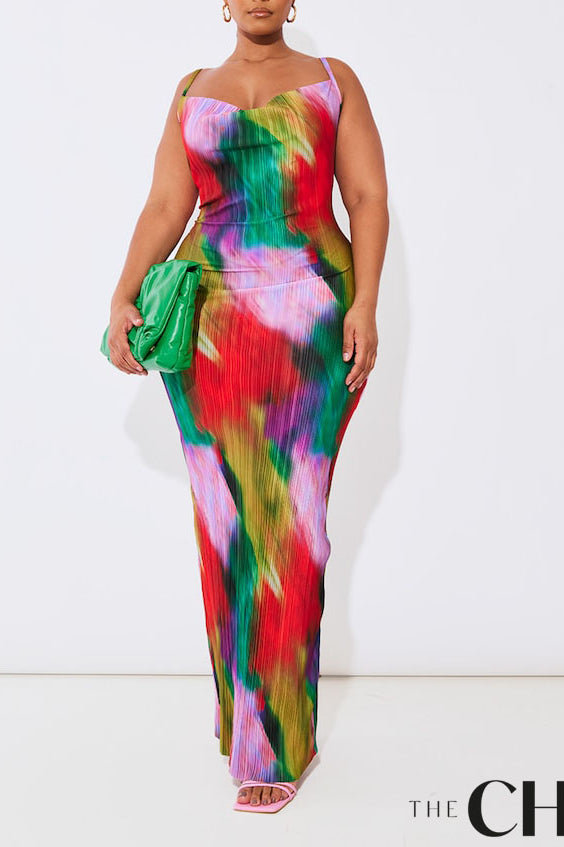 Plus size model wearing a vibrant abstract print plissé cowl neck bodycon maxi dress with adjustable spaghetti straps and a colourful summer design.