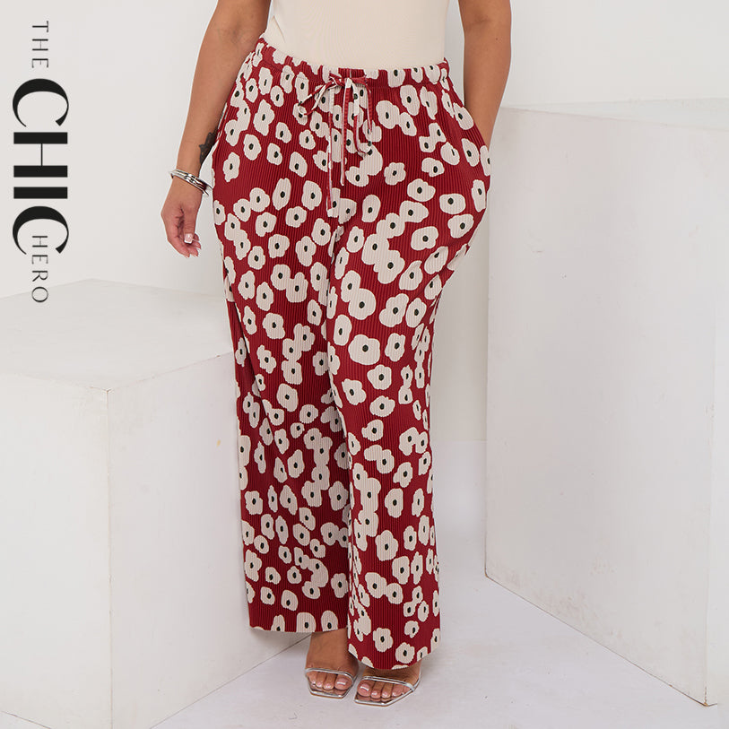 Red abstract print palazzo pleated trousers with pockets and a drawstring waist