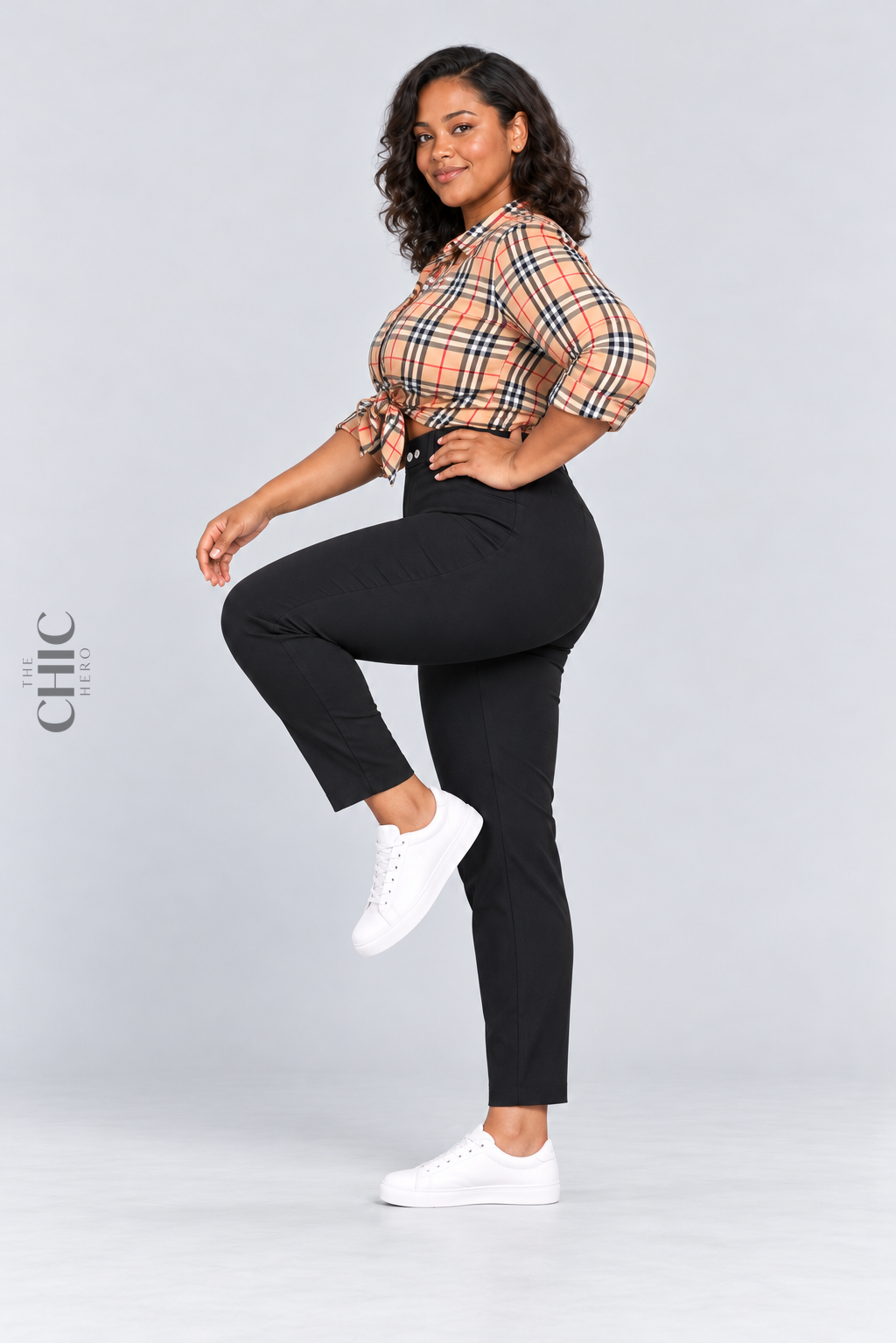 MODEL-03 demonstrating comfortable movement in black high-rise stretch pencil trousers with a natural side knee lift