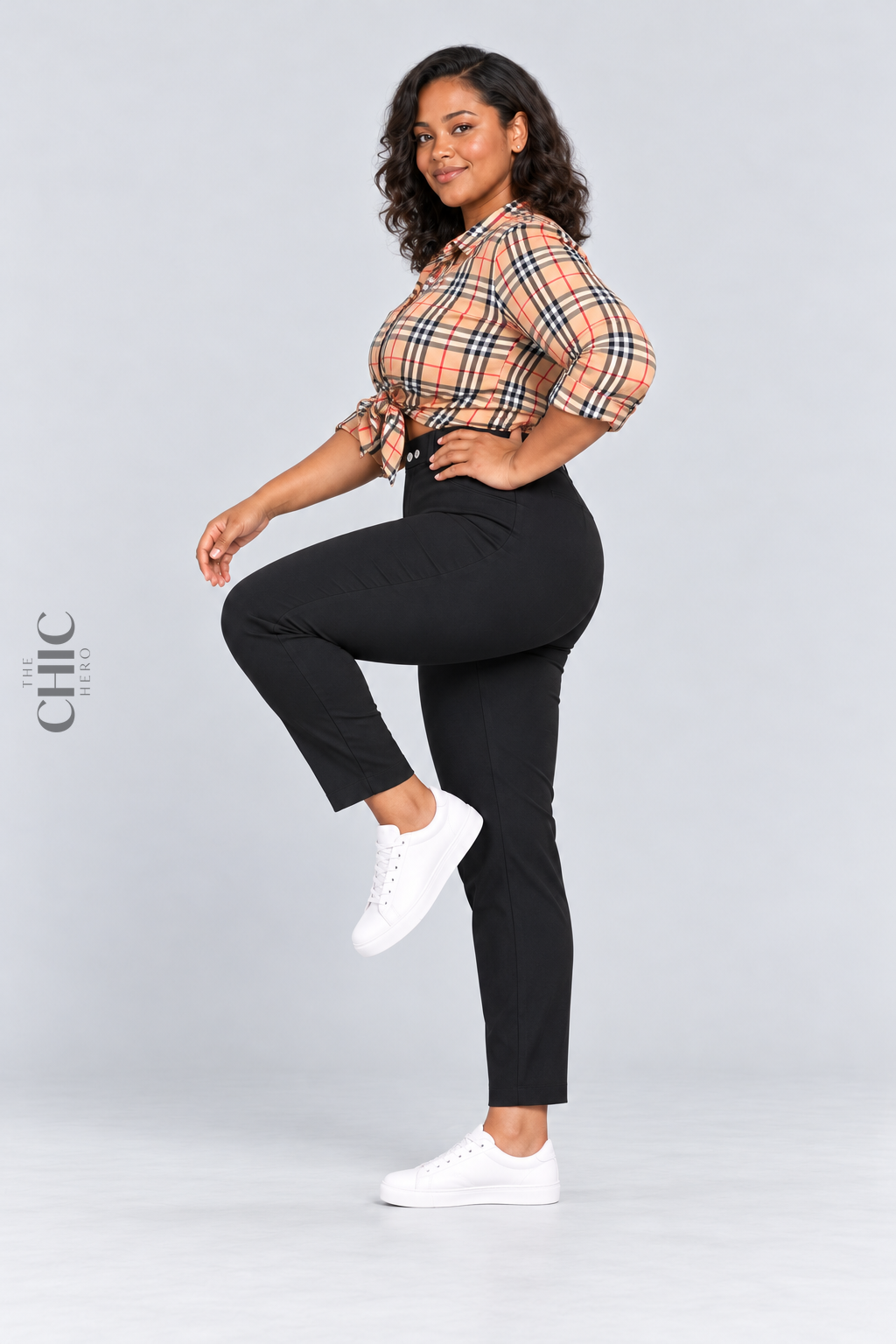 MODEL-03 demonstrating comfortable movement in black high-rise stretch pencil trousers with a natural side knee lift