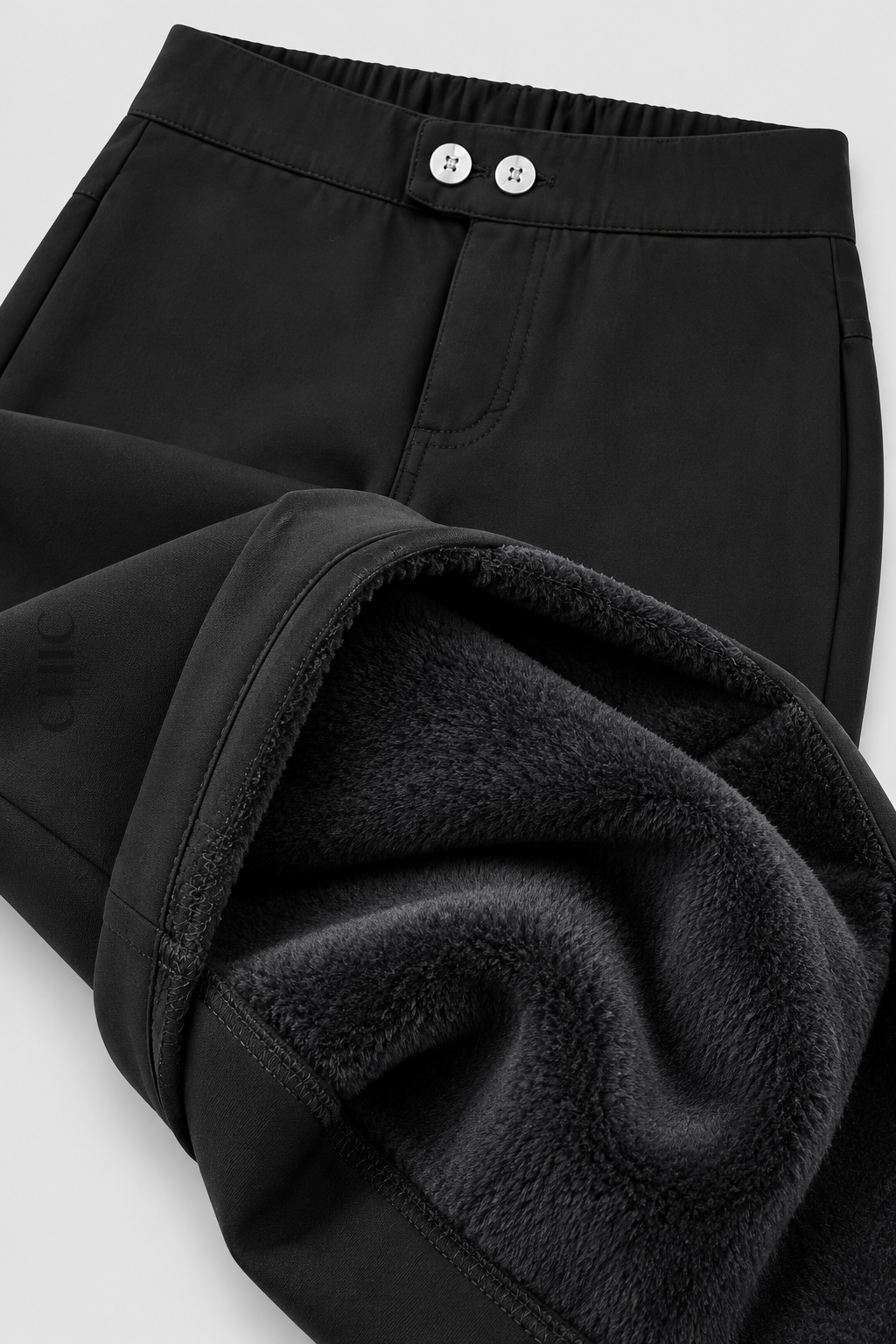 Black fleece-lined stretch pencil trousers showing the soft brushed inner layer