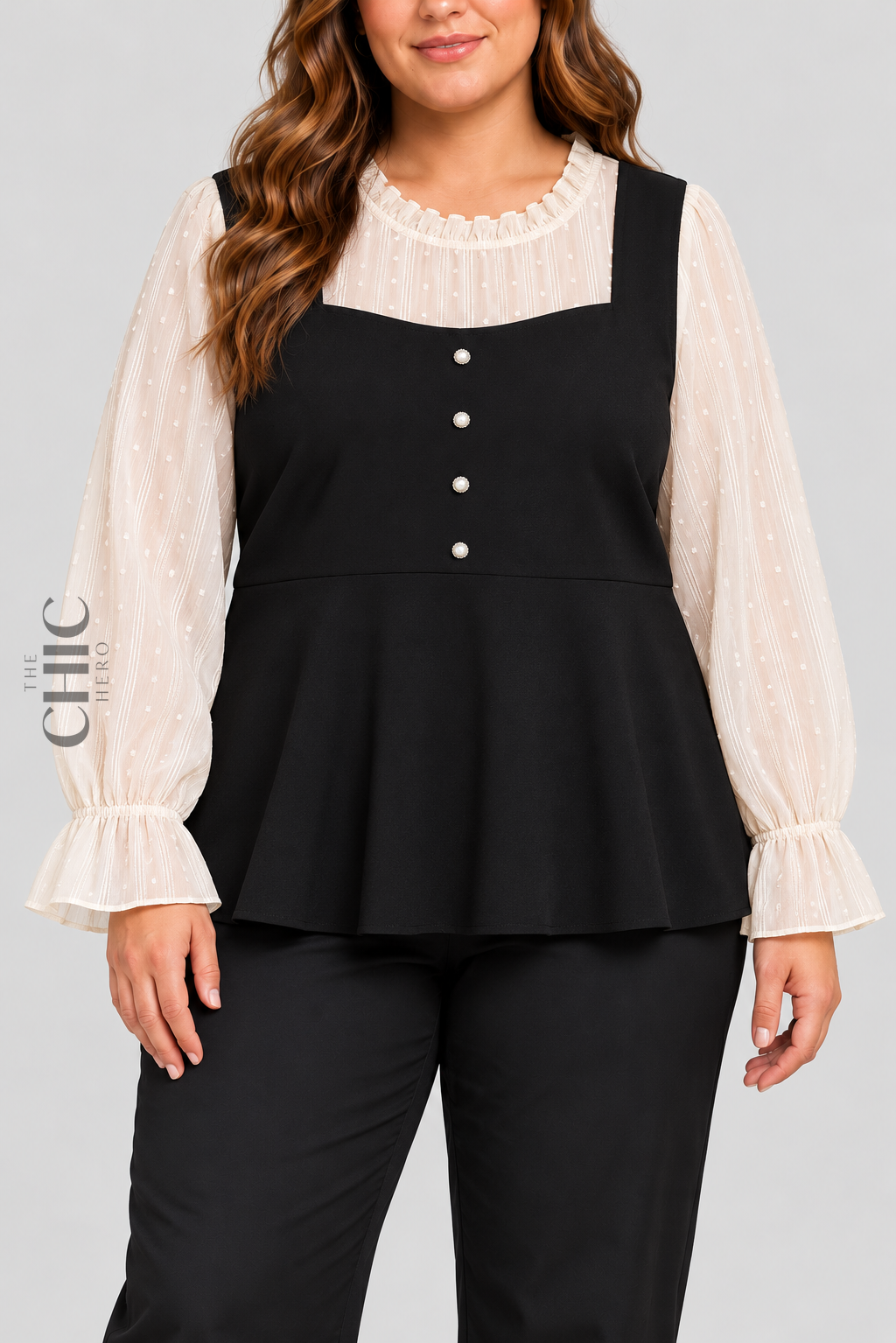 The Chic Hero black and ivory faux-layered peplum top front view on a plus size model