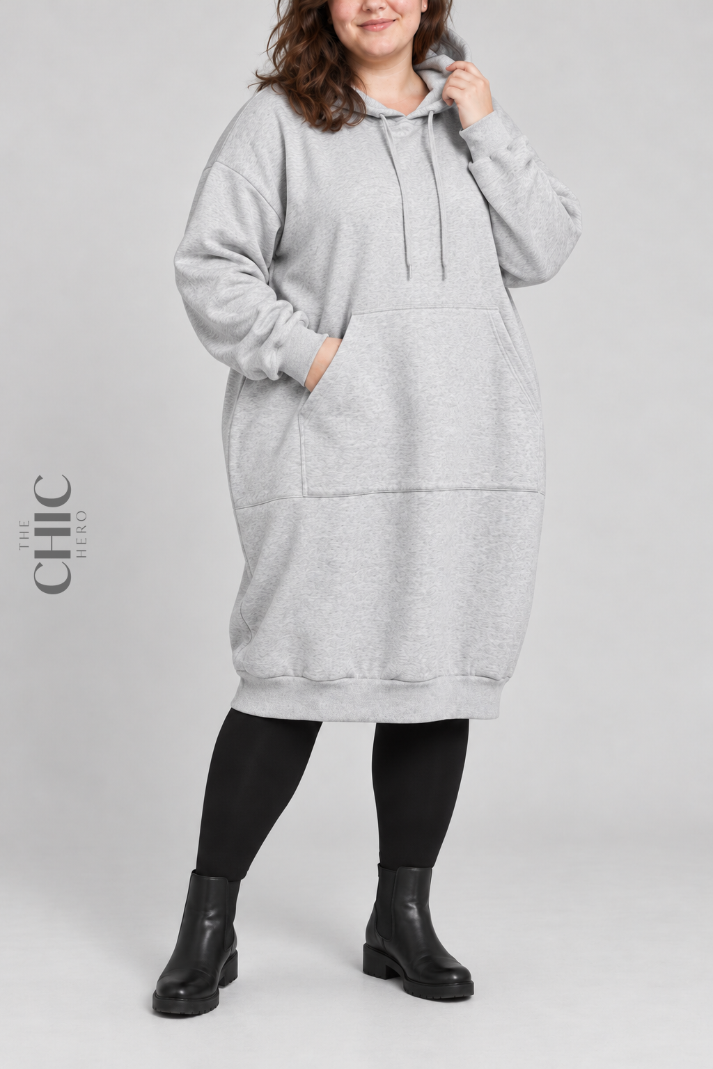 Grey longline hoodie with roomy kangaroo pocket on a UK22 model