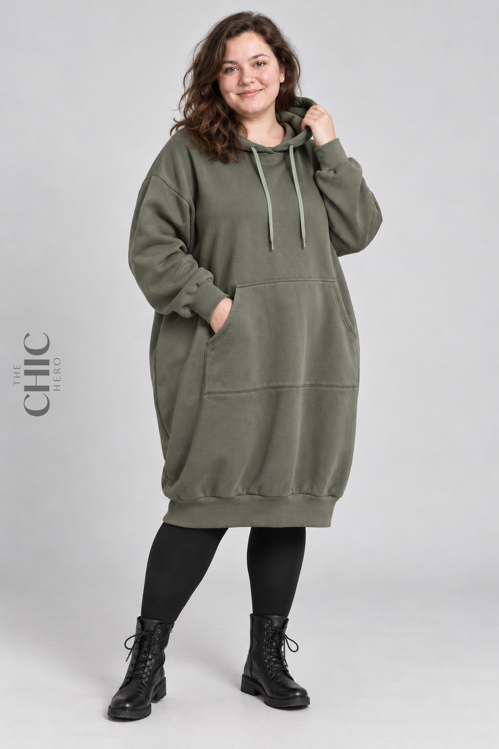 Khaki Green longline hoodie with roomy kangaroo pocket on a UK22 model