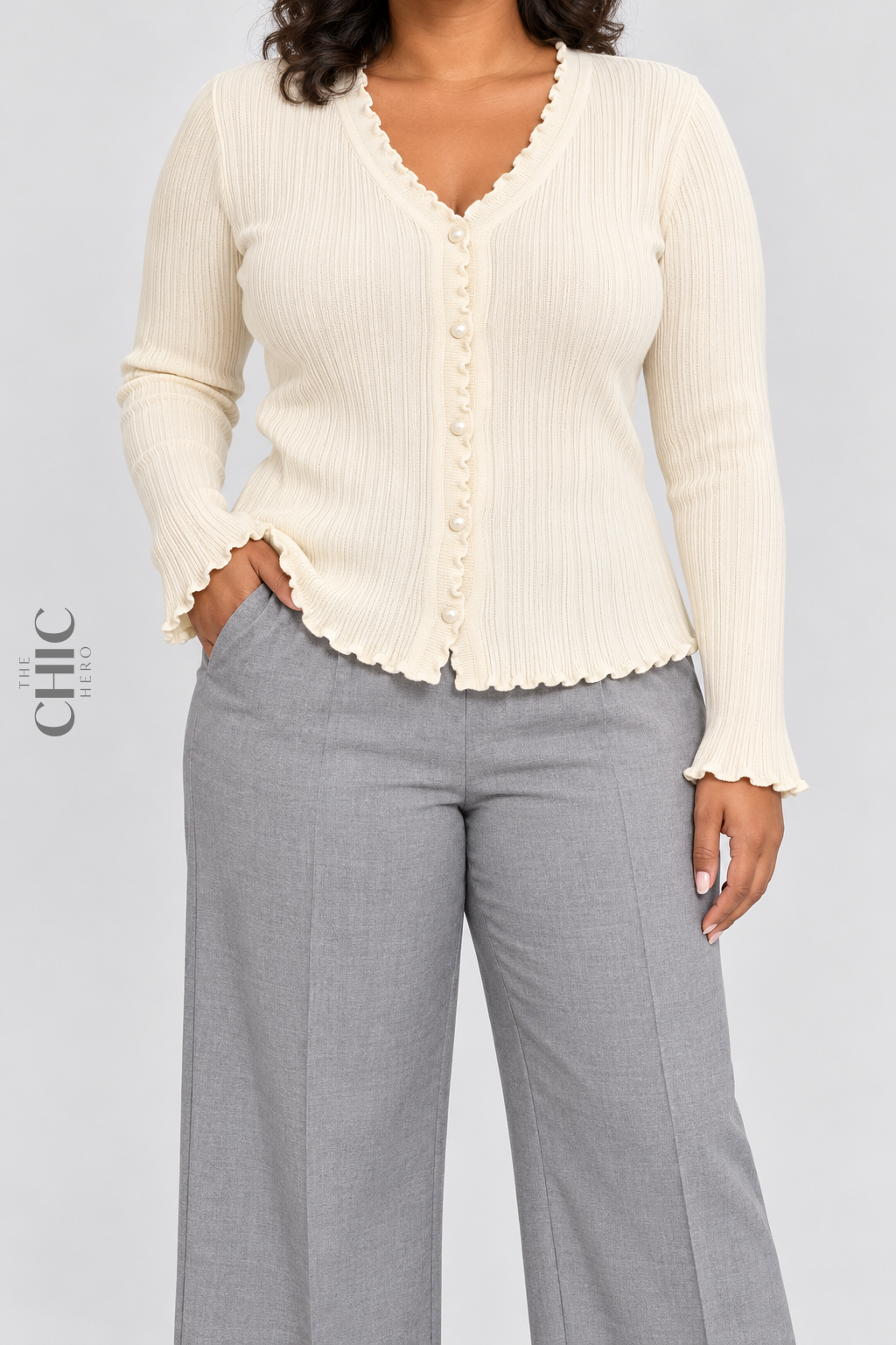 Cream ruffle-trim ribbed button-front cardigan on a faceless curvy model