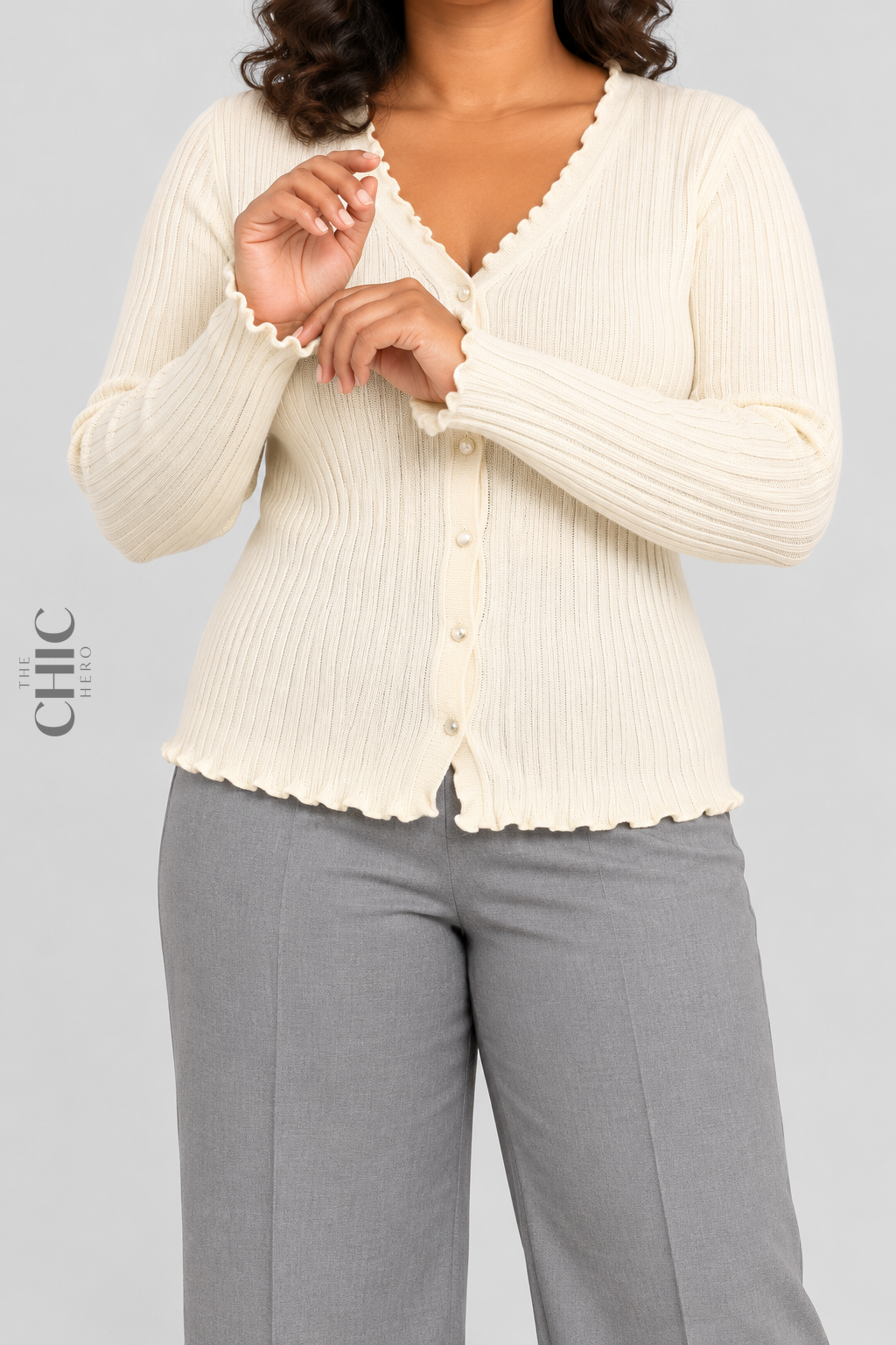 Cream ribbed cardigan with ruffle cuffs shown on a faceless curvy model