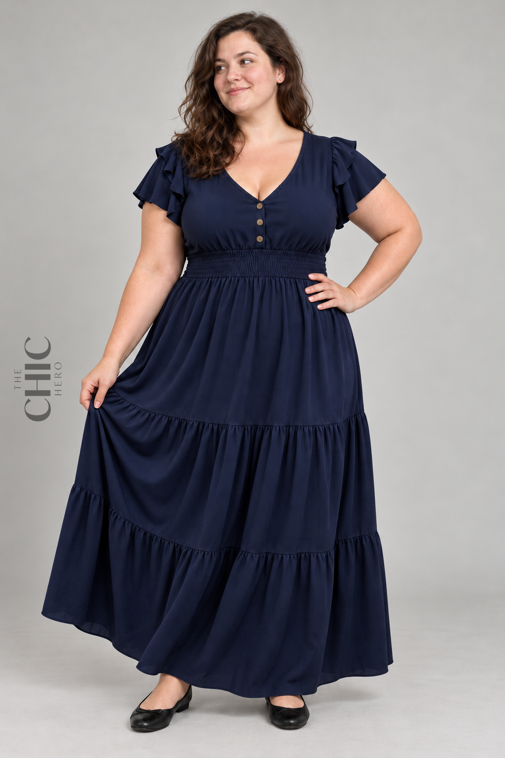 Blue flutter sleeve shirred waist maxi dress on a UK22 model