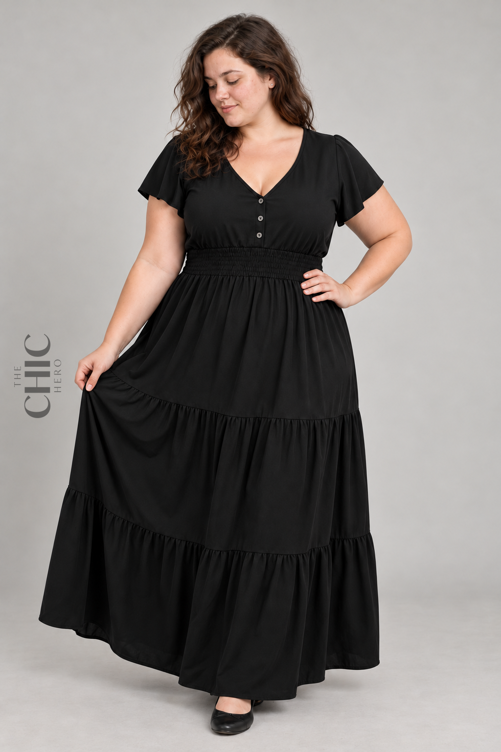 Black flutter sleeve shirred waist maxi dress on a UK22 model