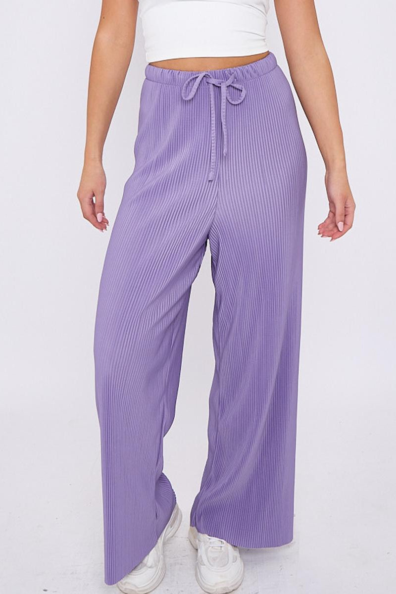 Plus size female model in purple lilac solid colour wide-leg drawstring palazzo pants, stretchy opaque crease-resistant fabric, sizes UK 8–32