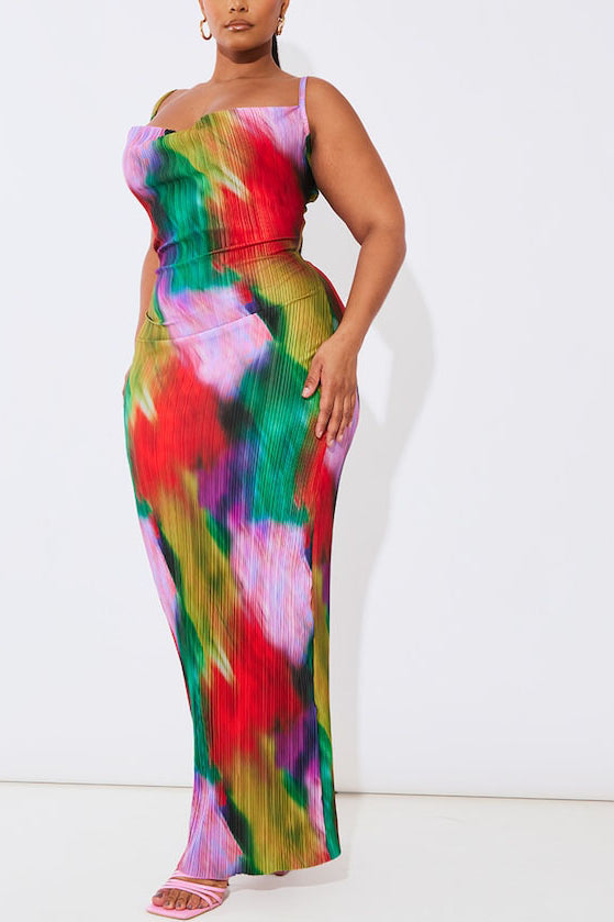 This image features a striking plus-sized maxi dress with a vibrant, multicolored print. The dress is designed with a plisse cowl neck and fits snugly, highlighting a sleek silhouette.