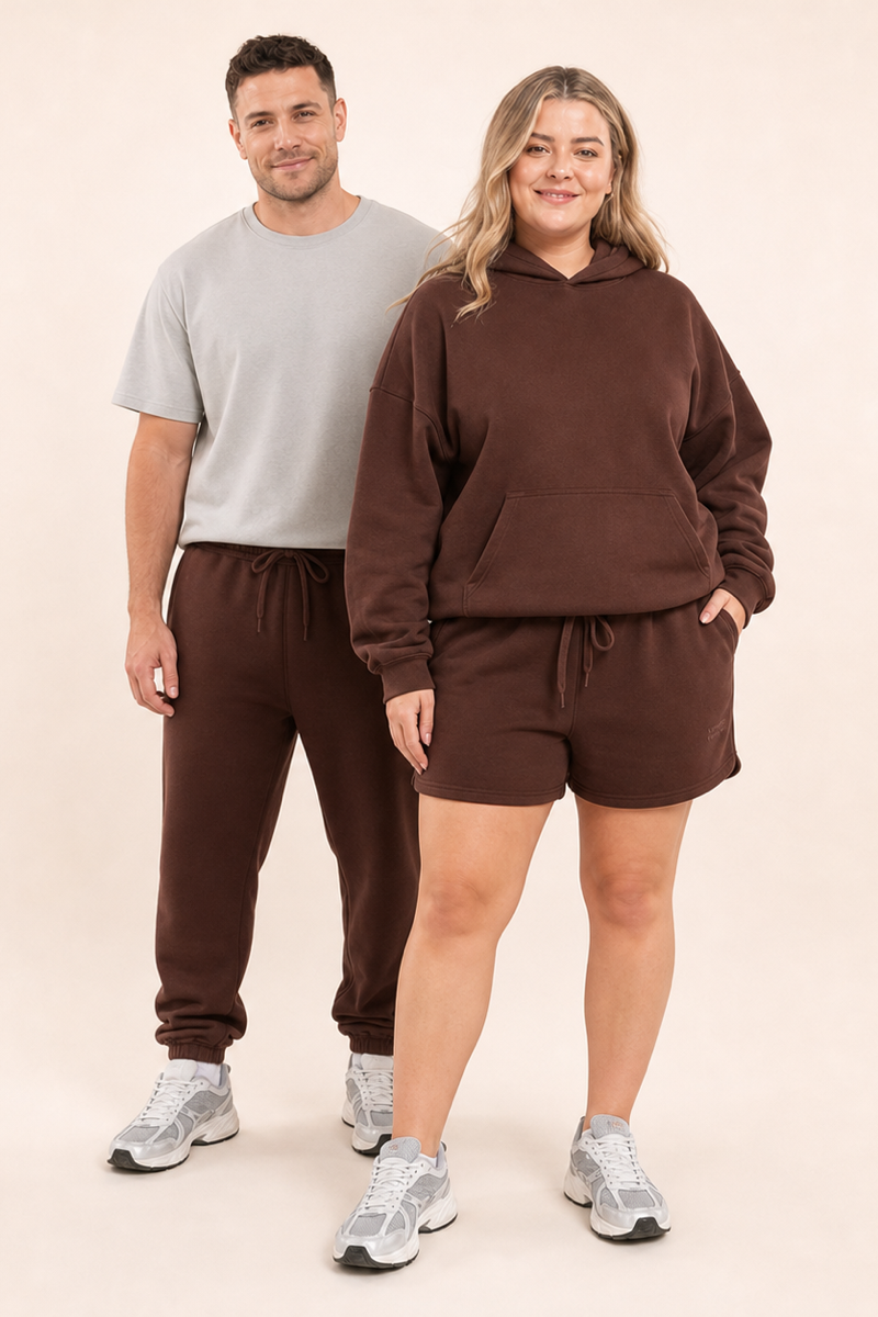 Male and female models wearing the ChicHero brown heavyweight hoodie and joggers