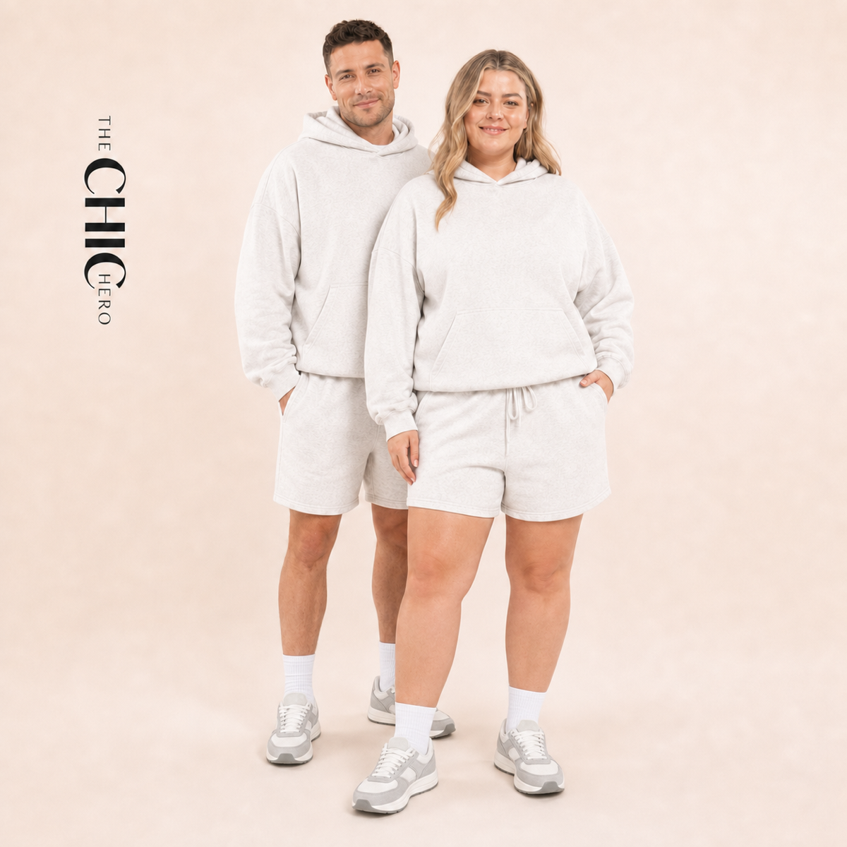 Male and female models wearing the ChicHero white heavyweight hoodie and shorts