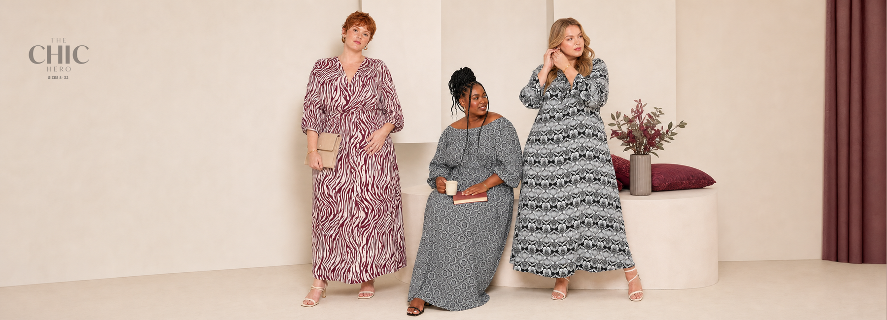 Three plus-size women in burgundy, monochrome and black printed long-sleeve maxi dresses  
