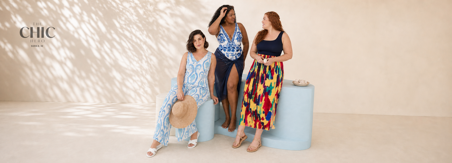 Three plus-size women in coordinated seaside blues summer looks in a natural studio scene &nbsp;