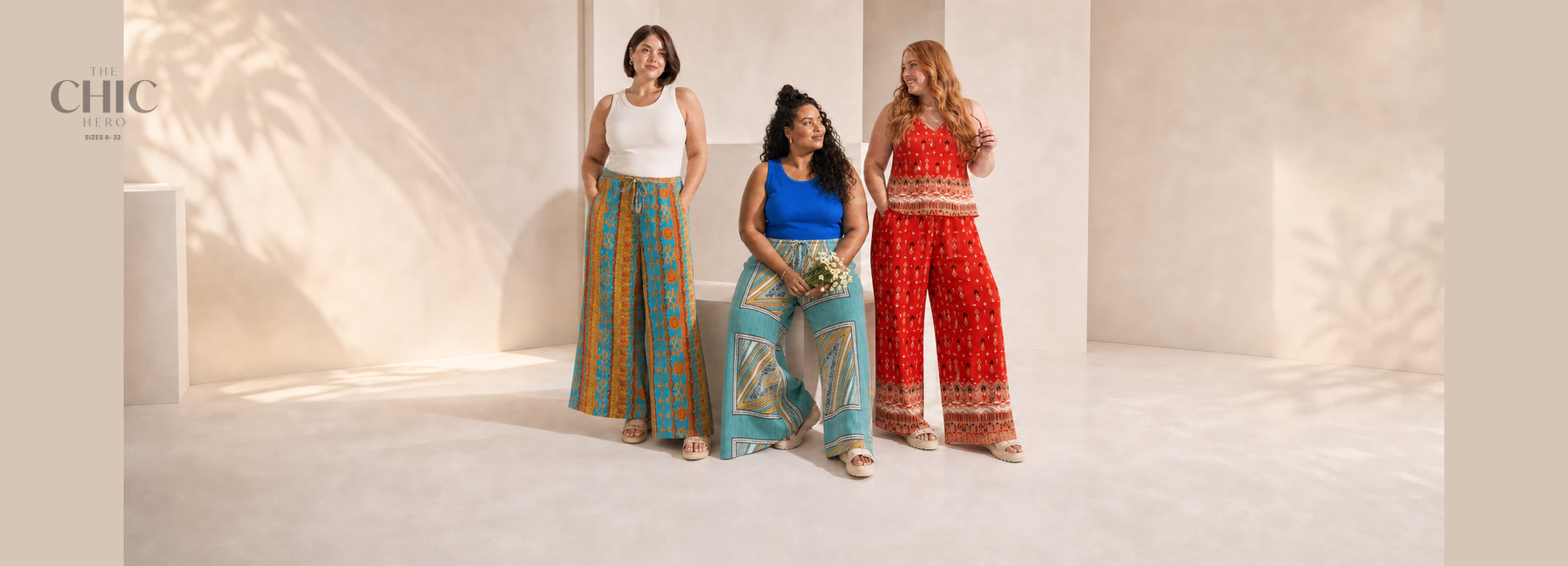 Three plus-size women in turquoise-orange, aqua scarf-panel and red tribal printed pleated outfits  