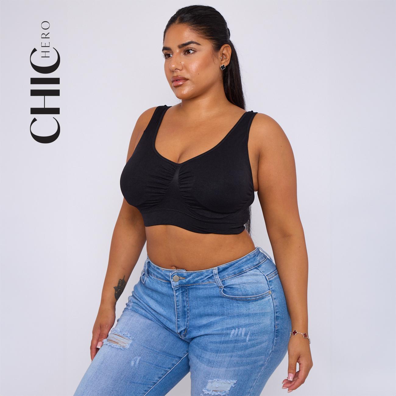 A woman modeling a black ruched scoop-neck crop top with wide shoulder straps, paired with light blue distressed jeans, against a light gray studio background. The brand name 'CHIC HERO' is printed vertically on the left side.