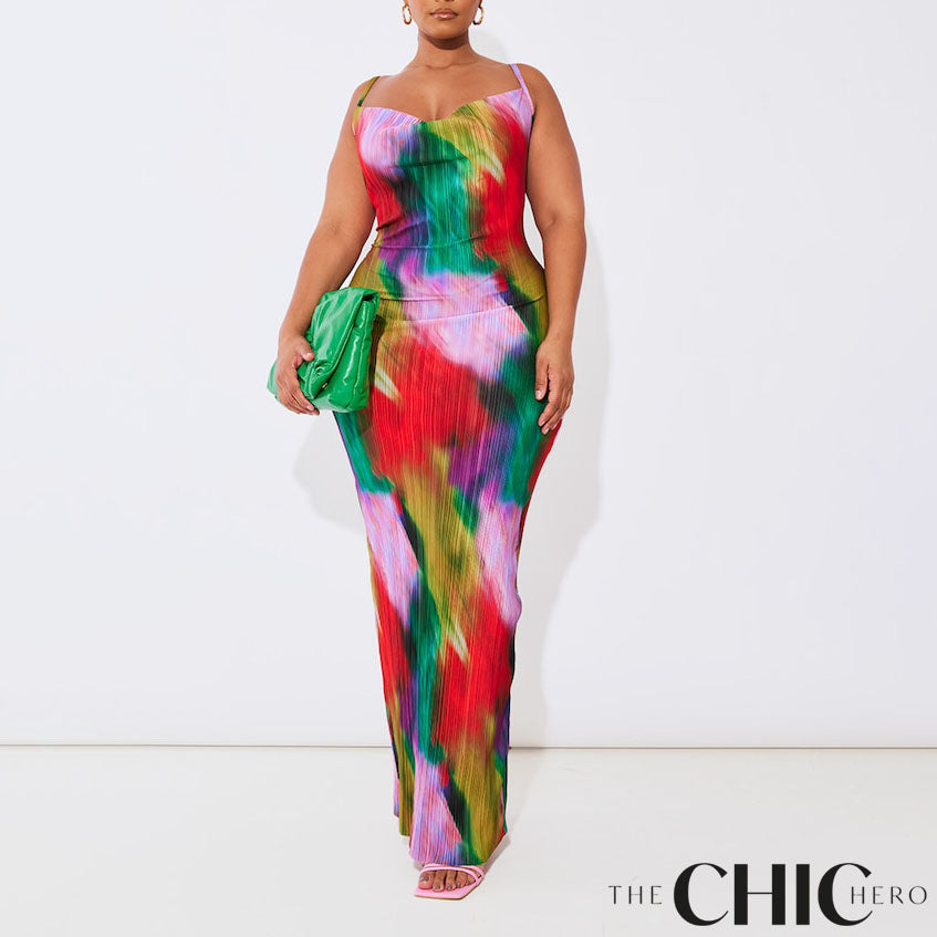 Plus size model wearing a vibrant abstract print plissé cowl neck bodycon maxi dress with adjustable spaghetti straps and a colourful summer design.