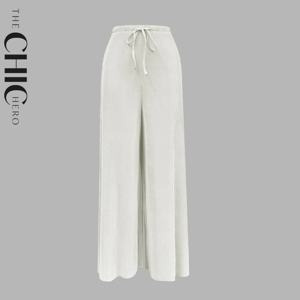 Plus size female model in white wide-leg drawstring palazzo pants, stretchy opaque crease-resistant fabric, sizes UK 8–32