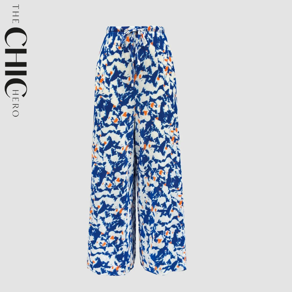 Plus size model wearing blue abstract cloud print wide-leg drawstring palazzo pants, stretchy opaque crease-resistant fabric