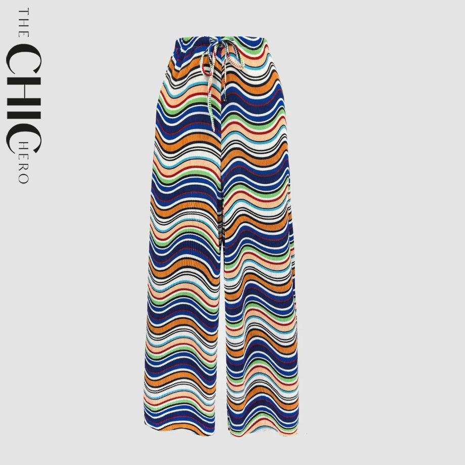 Plus size female model wearing monochrome ripple wide-leg drawstring pants with pockets, stretchy opaque crease-resistant fabric, sizes UK 8–32
