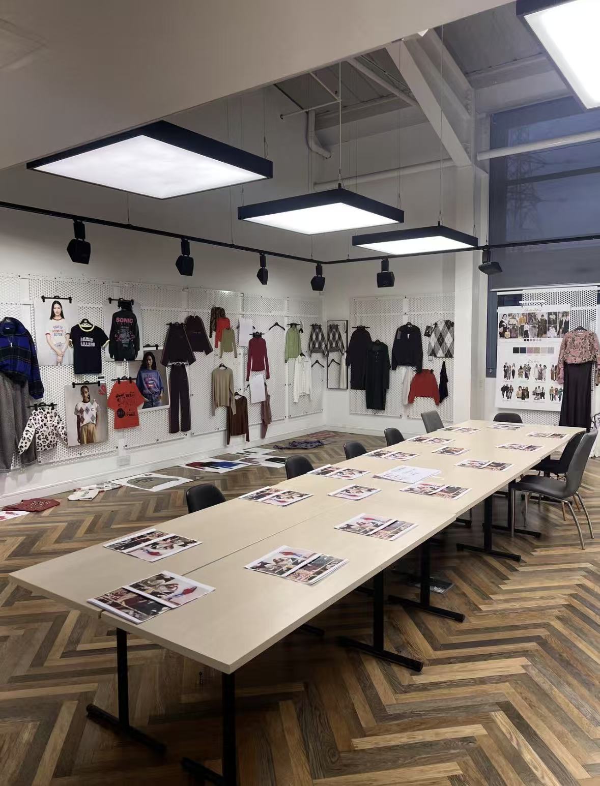 Garment samples, mood boards and a meeting table at The Chic Hero