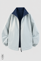 Blue Grey and Navy unisex reversible oversized windproof jacket, front product view.