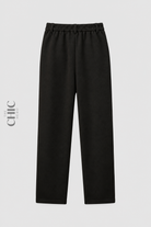 Plus size black fleece-lined relaxed trousers with elasticated back waist, back view