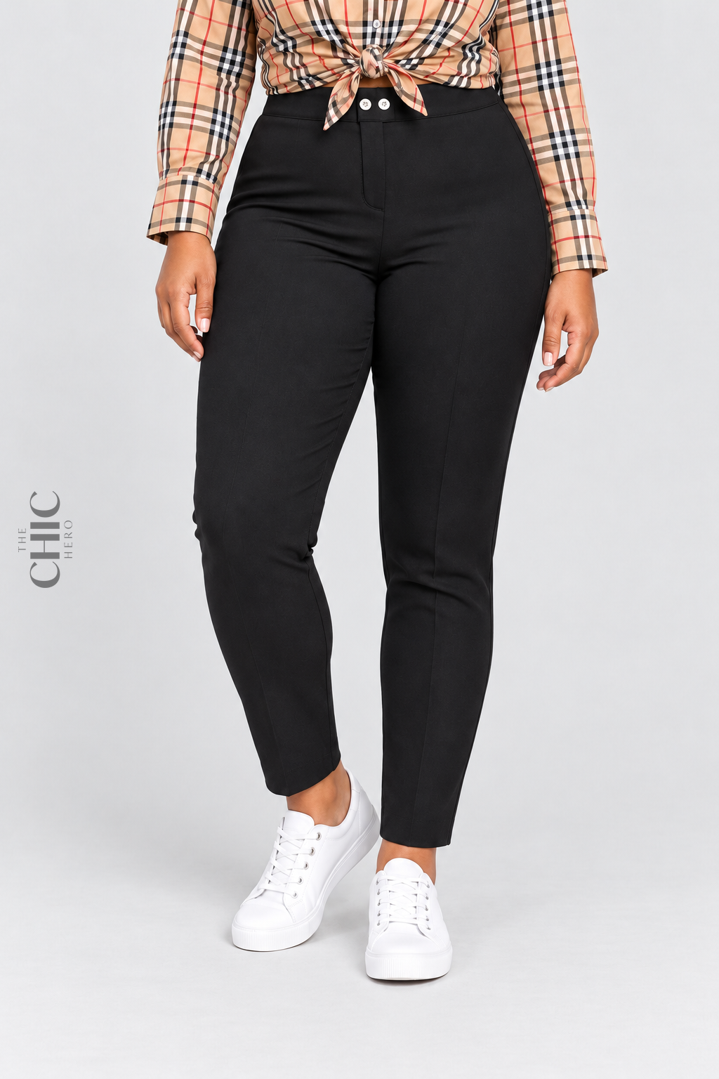 Black plus size high-rise stretch pencil trousers styled with a plaid shirt and white trainers, faceless waist-to-shoes view