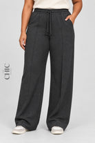 Women's dark grey plus size ribbed wide-leg trousers with a drawstring waist and side pockets