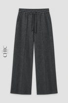 Dark grey ribbed wide-leg trousers front view with drawstring waist and pockets