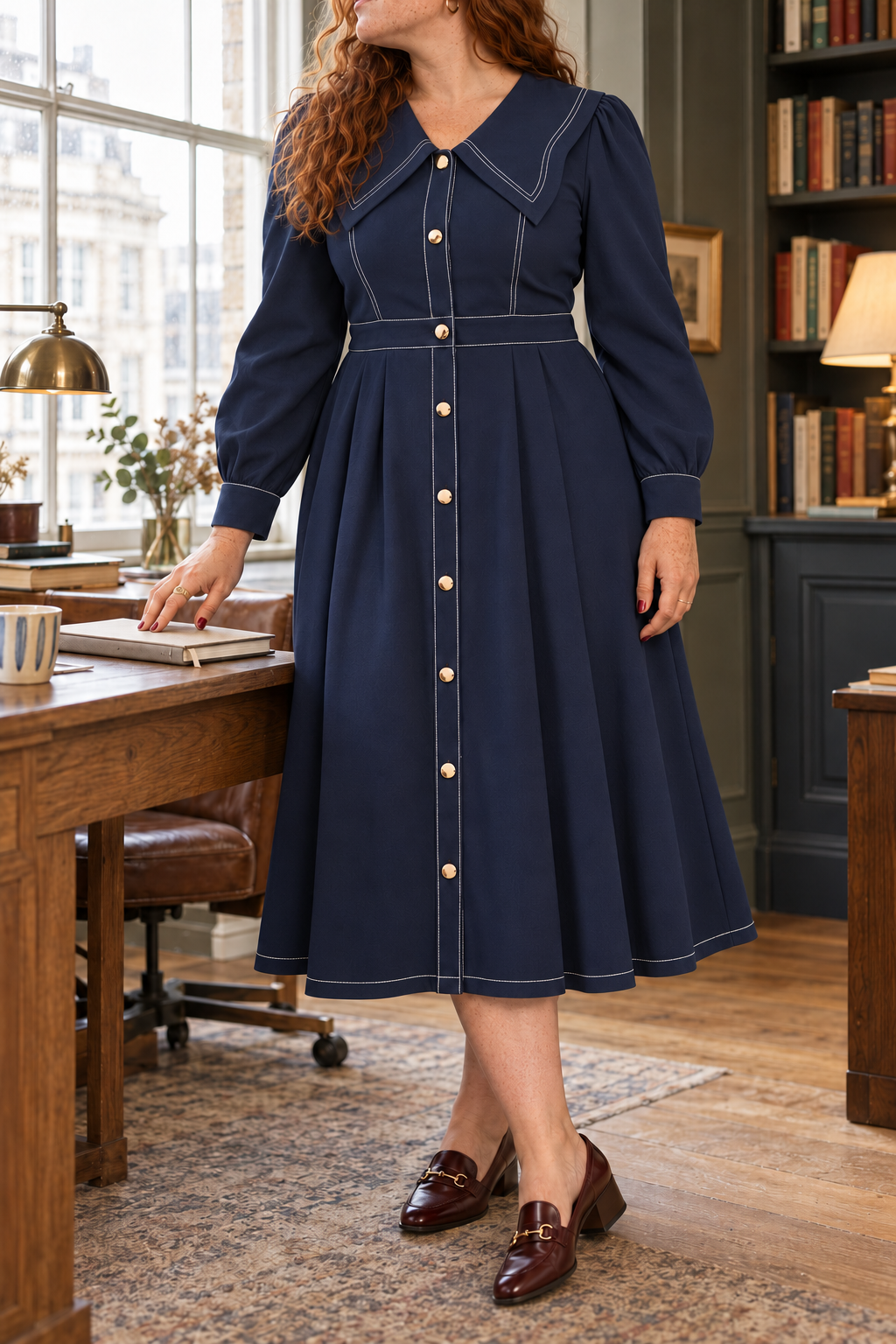 Navy sailor-collar midi dress styled in an elegant British office