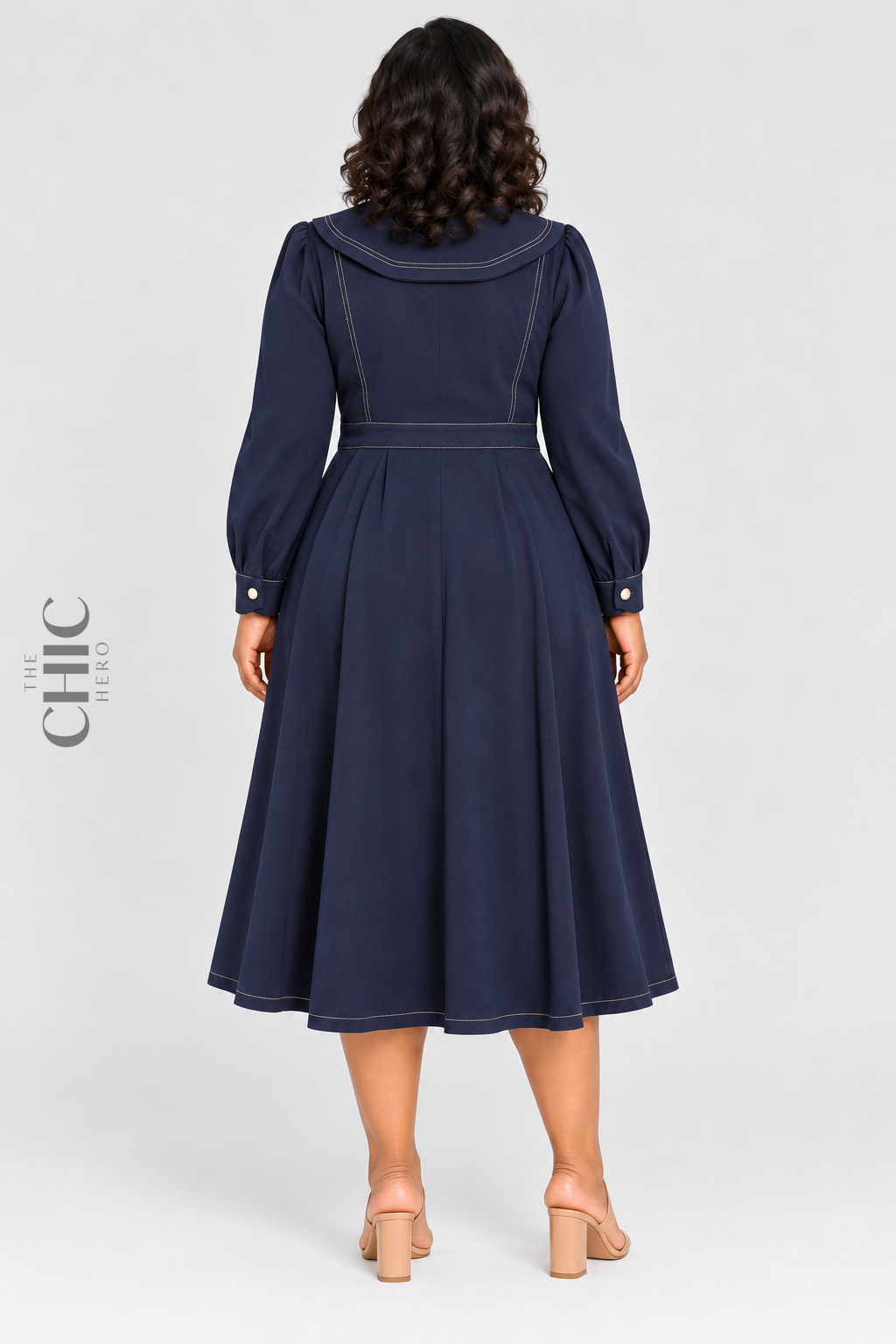 Navy sailor collar midi dress back view showing the shaped waist and flared skirt