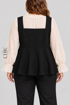 Black and ivory faux-layered peplum top back view