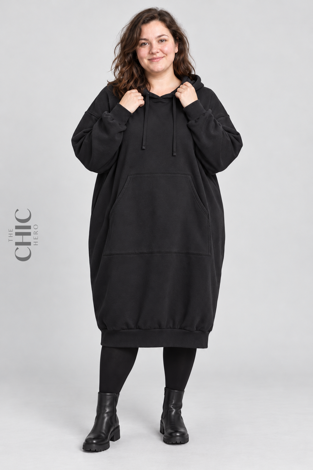 Black fleece-lined oversized longline hoodie on a UK22 model