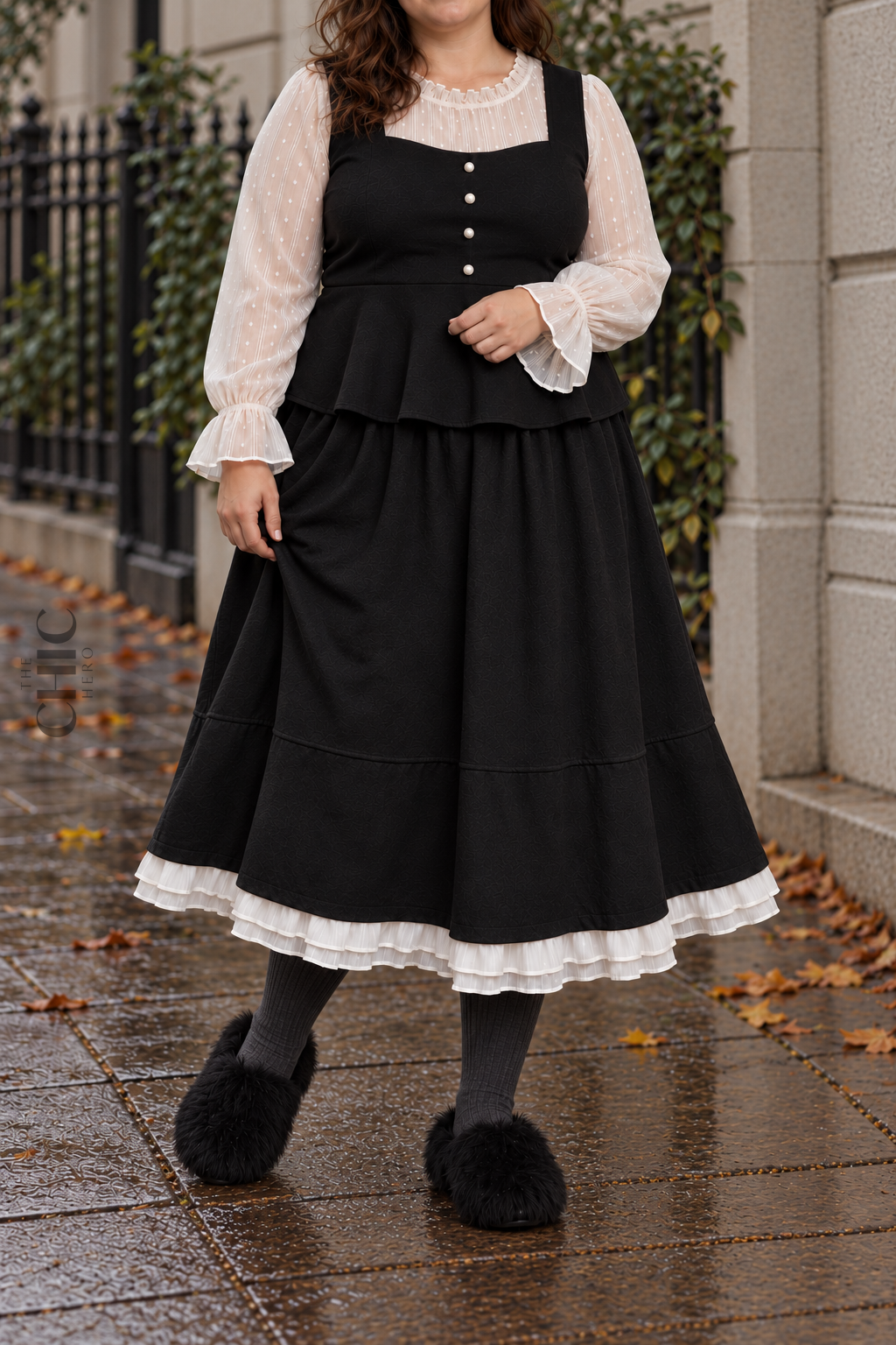Black long A-line winter skirt styled with a black peplum top, grey socks and fluffy shoes