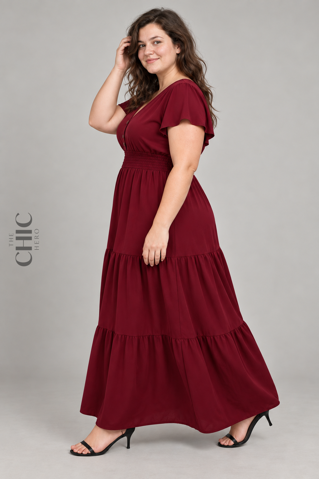 Side view of red tiered maxi dress with flutter sleeves