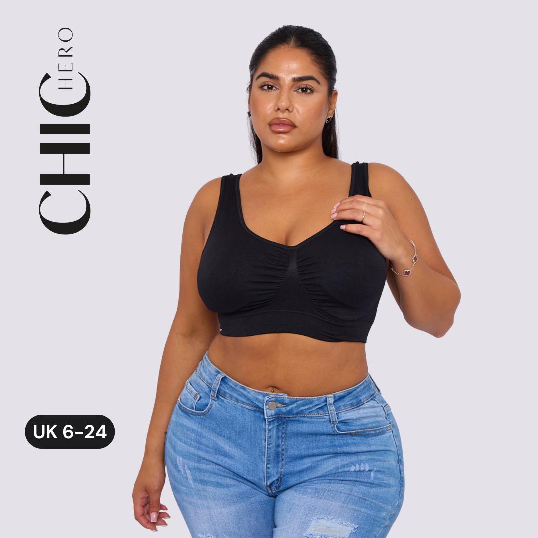 A woman modeling a black scoop-neck crop top with gathered detailing, paired with light-wash blue jeans, against a light gray background. The brand name 'CHIC HERO' is displayed vertically on the left, along with a size label 'UK 6-24'.