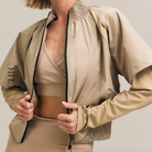 The Chic Hero Cream Gathered-Hem Zip Jacket – Pace front product image