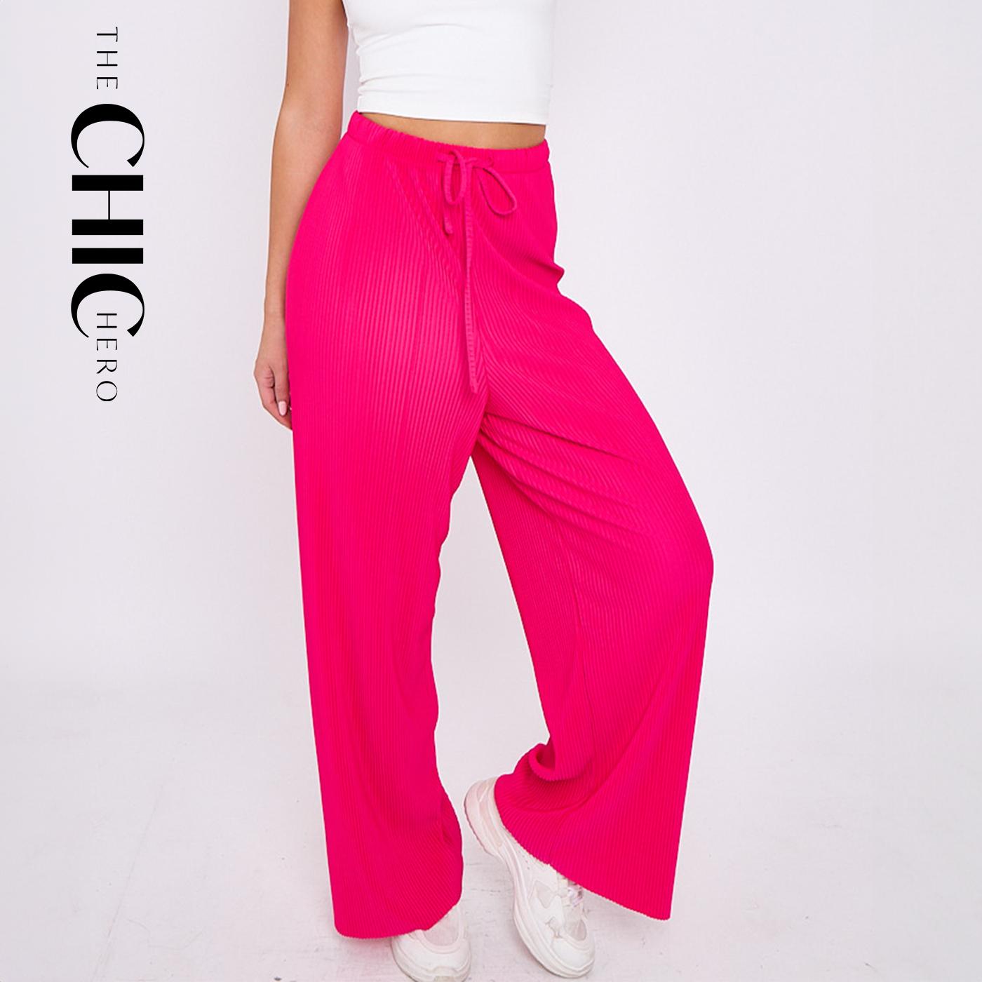 Plus size female model wearing pink magenta solid colour wide-leg drawstring palazzo pants, stretchy opaque crease-resistant fabric, sizes UK 8–32