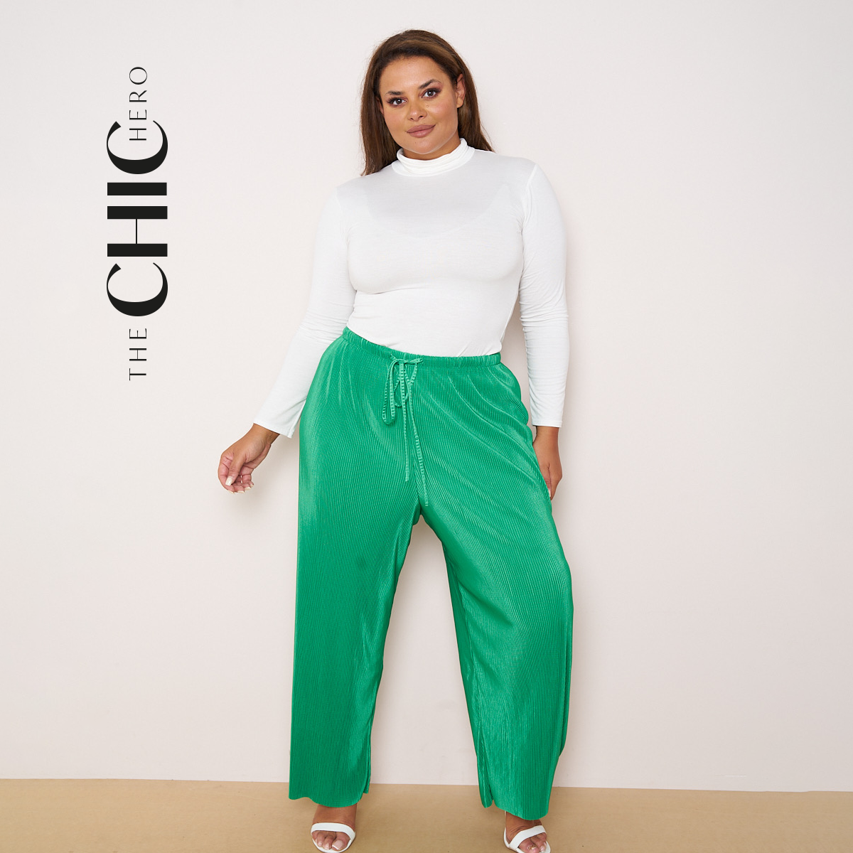 Plus size model in green pleated wide-leg palazzo pants, stretchy opaque crease-resistant fabric with flattering drawstring waist