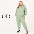 Model wearing the ChicHero pink fleece hoodie and jogger tracksuit
