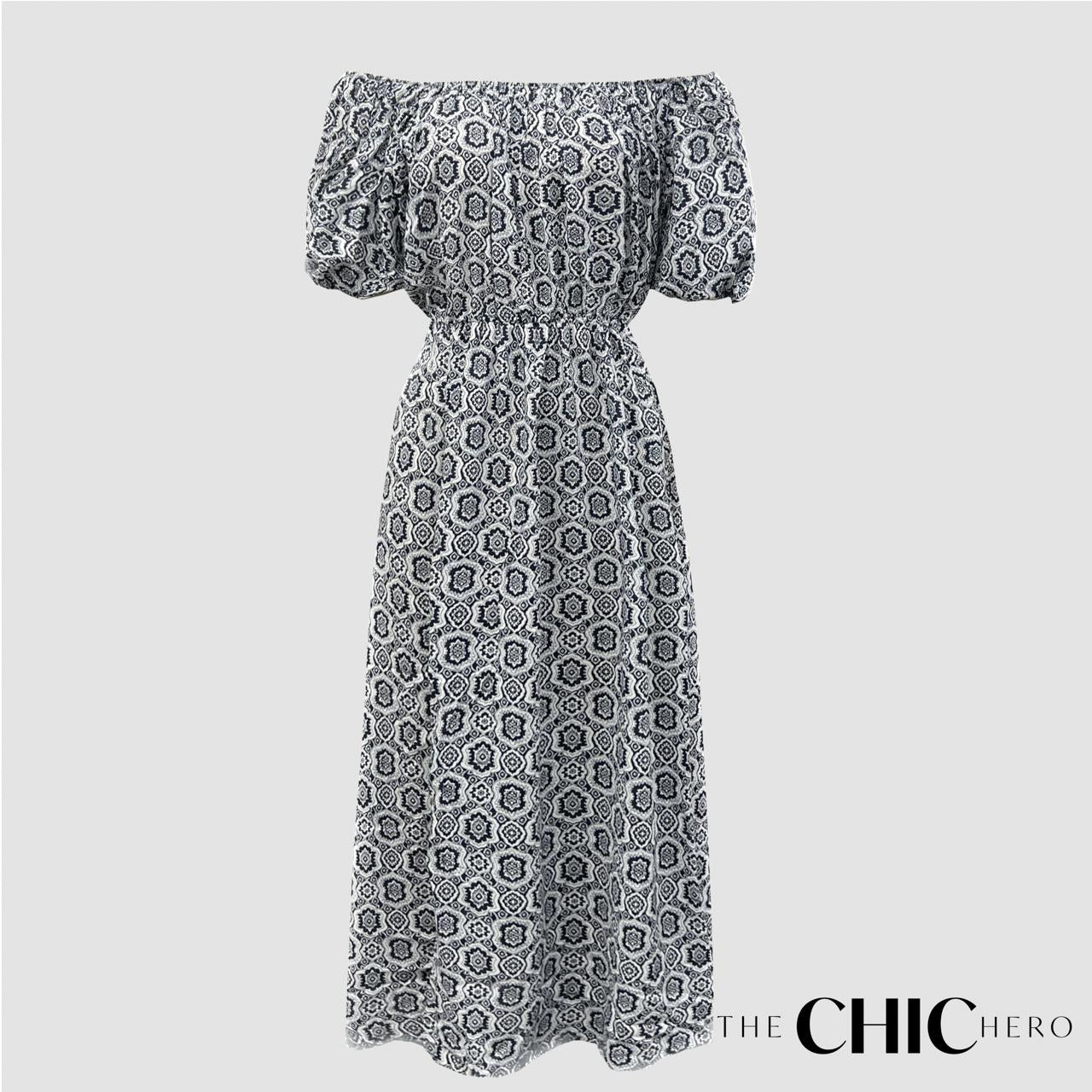 A long sleeve vintage style maxi dress in a mono print with a floral pattern, designed by THE CHIC HERO.